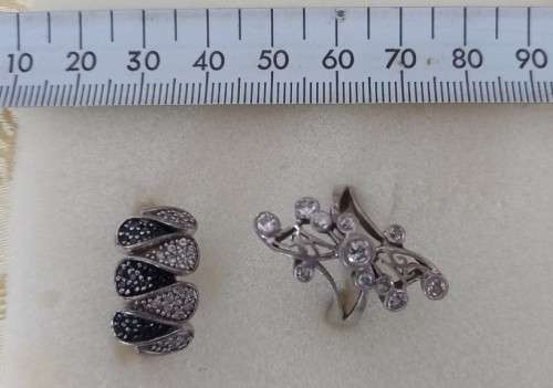 TWO STERLING SILVER RINGS SET WITH BLACK AND WHITE CZ STONES