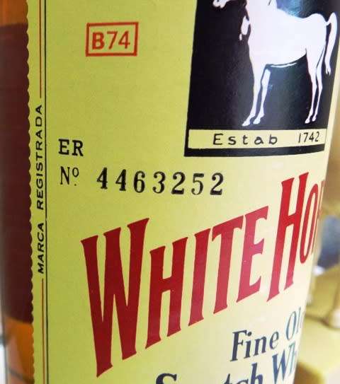 SUPER RARE ,,WHITE HORSE WHISKY  sealed bottle ,,,BOTTLED IN THE 1970s,