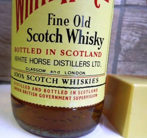 SUPER RARE ,,WHITE HORSE WHISKY  sealed bottle ,,,BOTTLED IN THE 1970s,