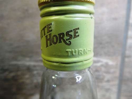 SUPER RARE ,,WHITE HORSE WHISKY  sealed bottle ,,,BOTTLED IN THE 1970s,