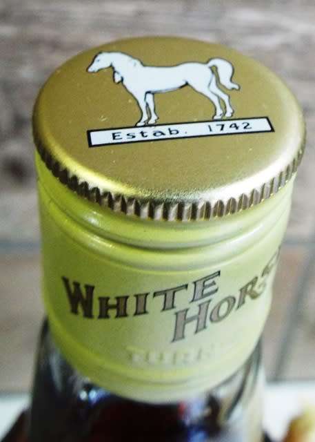 SUPER RARE ,,WHITE HORSE WHISKY  sealed bottle ,,,BOTTLED IN THE 1970s,