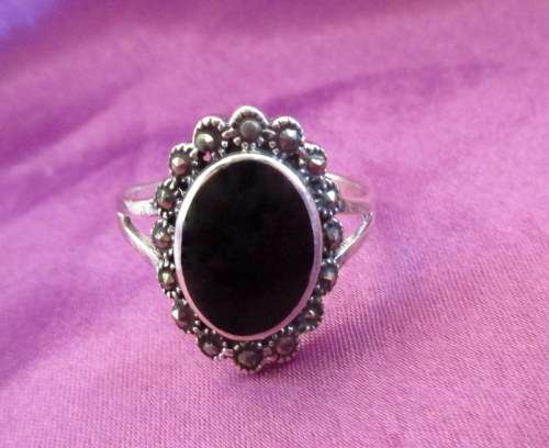 A ,925 STERLING SILVER RING WITH MARCASITE AND ONYX--NEW