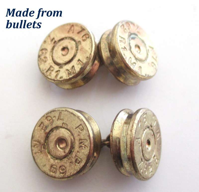 A cufflink box with cufflinks including a trench art pair made from bullets