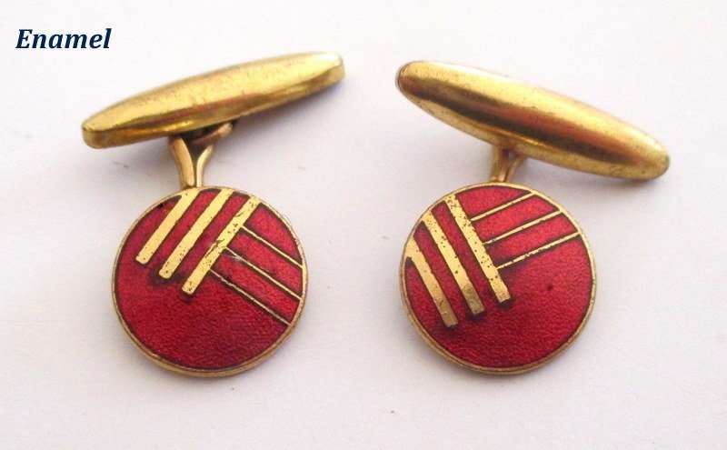 A cufflink box with cufflinks including a trench art pair made from bullets