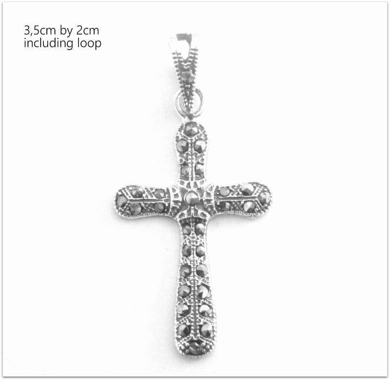 A SOLID SILVER MARCASITE CROSS