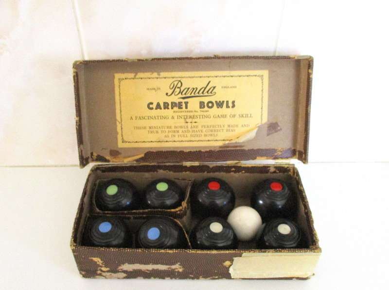 A SET OF CARPET BOWLS