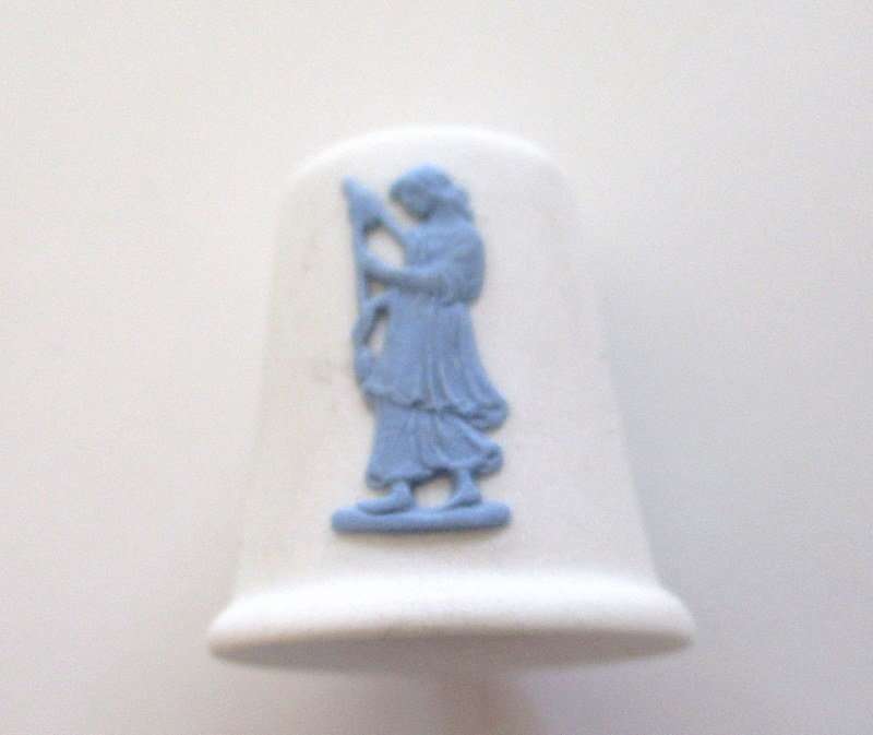A WHITE AND BLUE WEDGWOOD THIMBLE