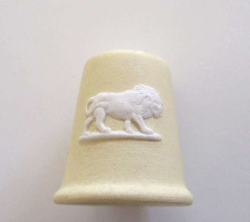 A CREAM AND WHITE WEDGWOOD THIMBLE