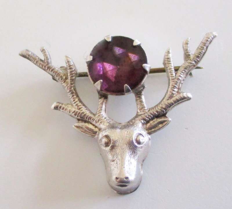 A VINTAGE STERLING SILVER  AND AMETHYST SCOTTISH STAG BROOCH BY WBS--WARD BROS.