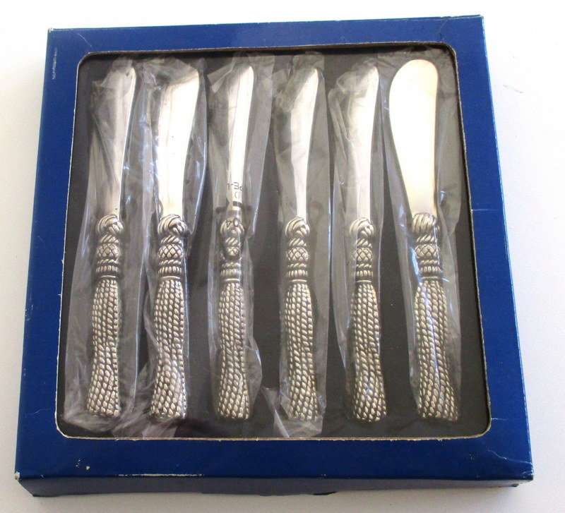 A SET OF SIX BUTTER KNIVES IN ORIGINAL UNOPENED PACKAGING