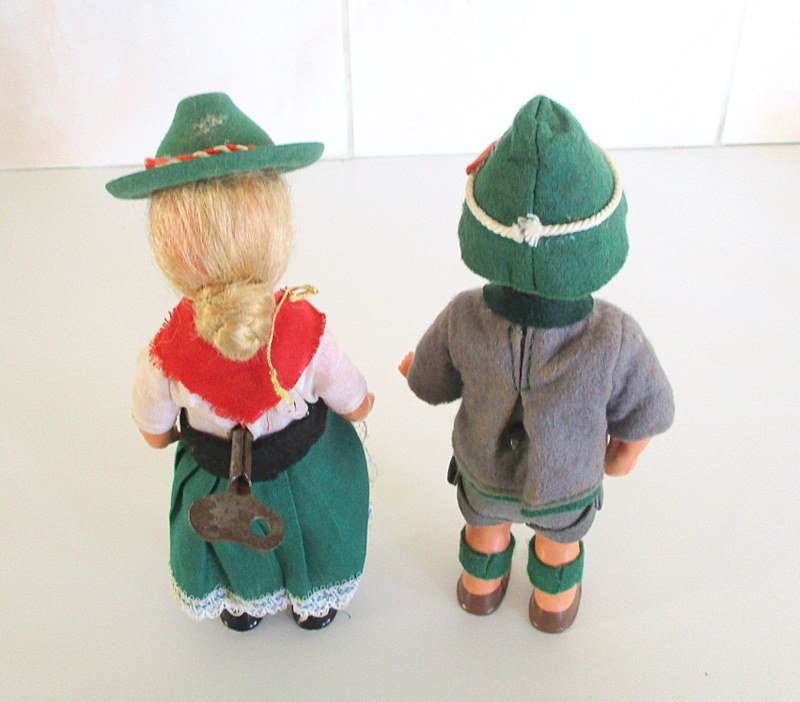 A PAIR OF VINTAGE KEY WIND DANCING DOLLS IN PERFECT WORKING ORDER