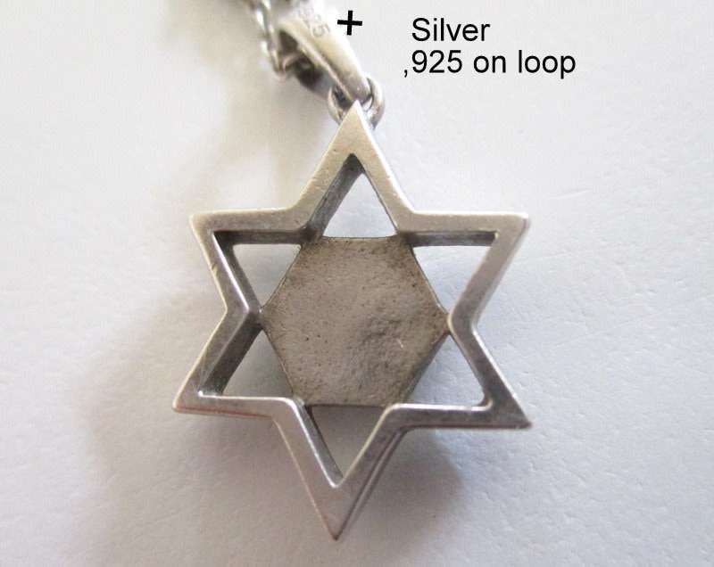 A SOLID SILVER STAR OF DAVID PENDANT ON A SILVER CHAIN WITH GRADUATED BALLS