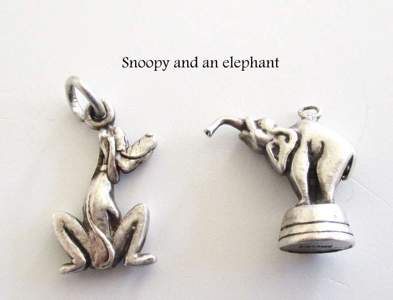 A LOT OF SOLID SILVER CHARMS--- 21,6 Gram