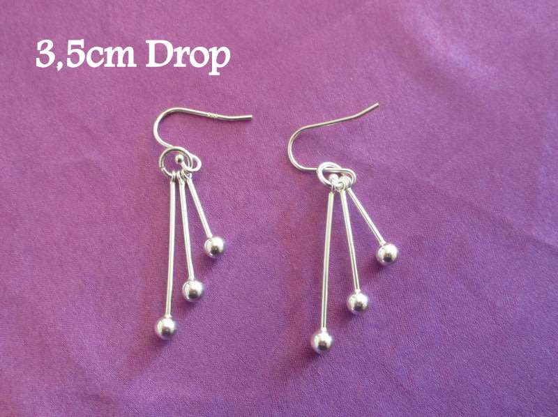 A PAIR OF SOLID SILVER DROP EARRINGS