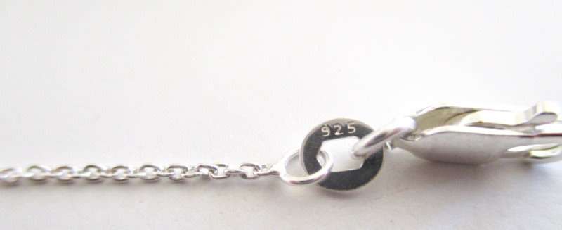 A SOLID SILVER NECKLACE WITH SILVER BALLS
