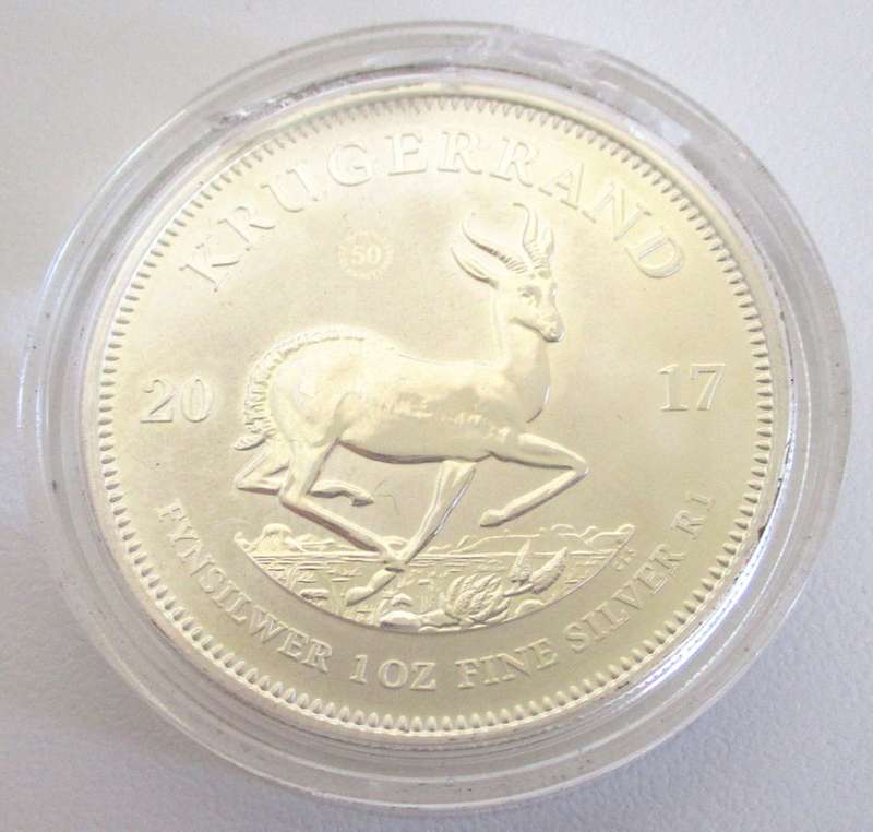 A 2017 KRUGER 1 OUNCE SILVER RAND IN A SEALED CAPSULE