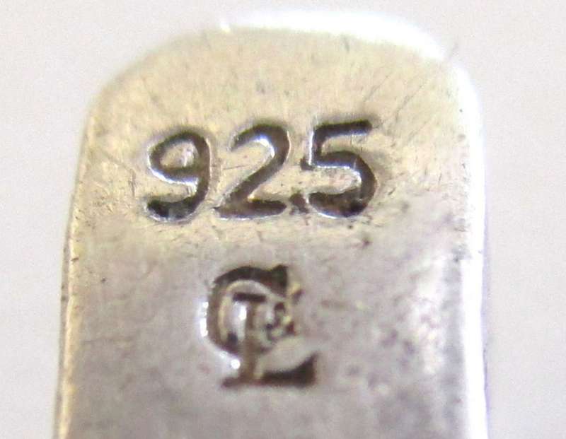 A SOLID SILVER TENNIS BRACELET WITH A WELL MADE CLASP--PLEASE SEE ALL IMAGES