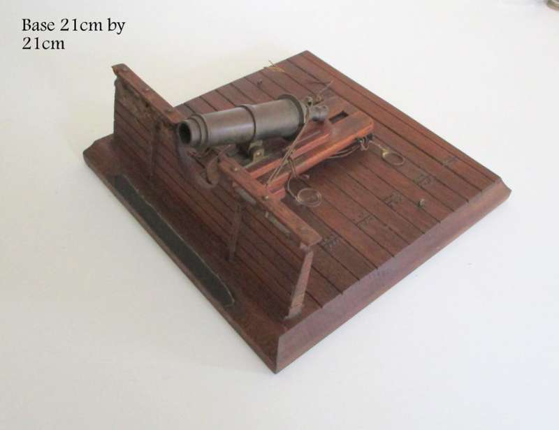 A WOOD AND BRASS REPLICA CANON