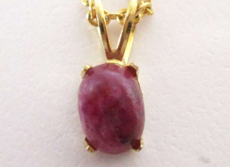 A LOT OF COSTUME JEWELLERY INCLUDING A RELIGIOUS PENDANT