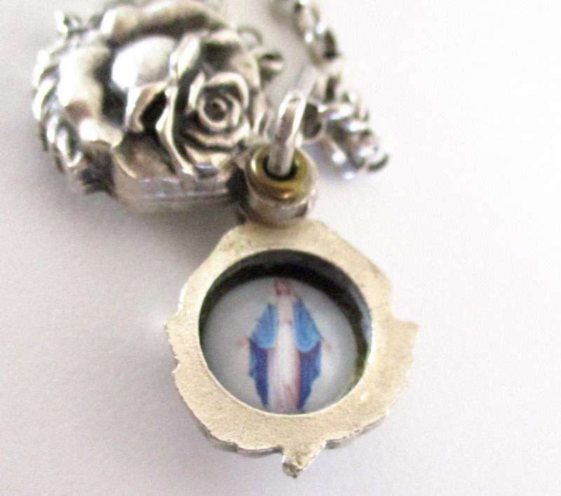 A LOT OF COSTUME JEWELLERY INCLUDING A RELIGIOUS PENDANT