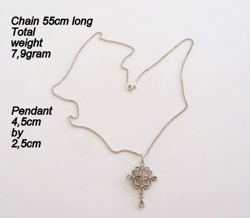 A SOLID SILVER PENDANT ON A SOLID SILVER CHAIN--PRETTY