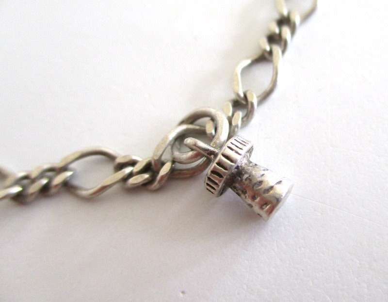A SOLID SILVER CHARM BRACELET