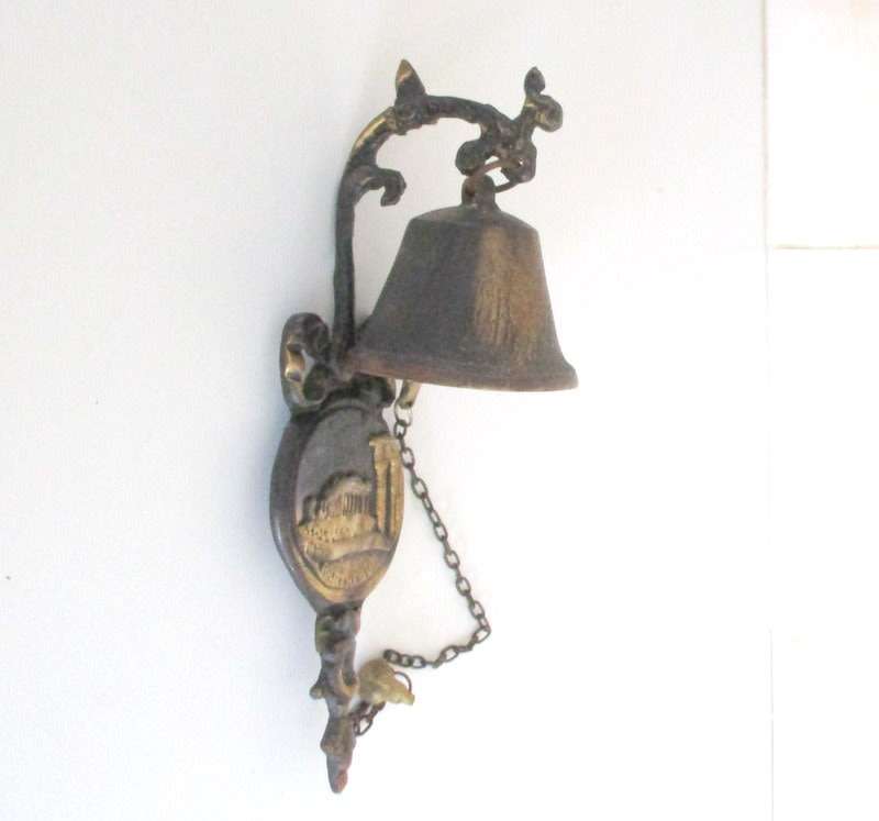 A VINTAGE METAL BELL