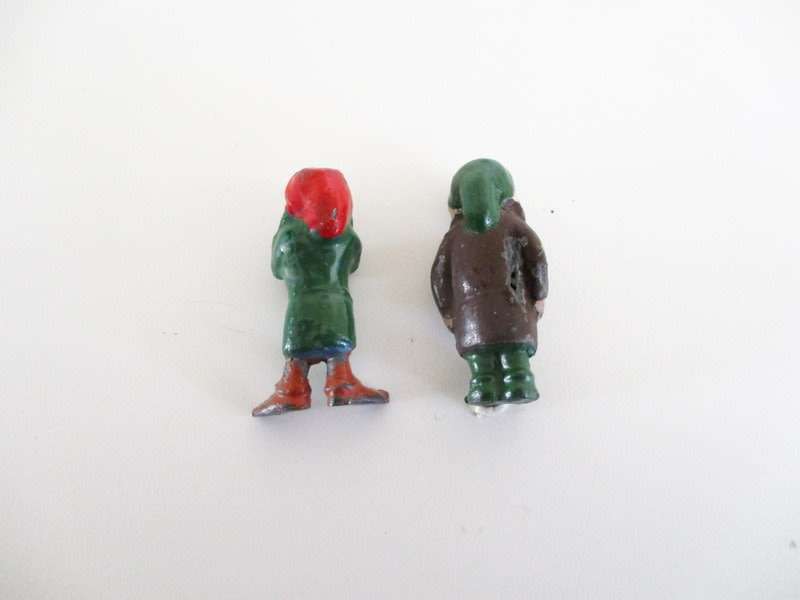 A VINTAGE LEAD CANADIAN MOUNTED POLICEMAN AND 2 LEAD DWARFS