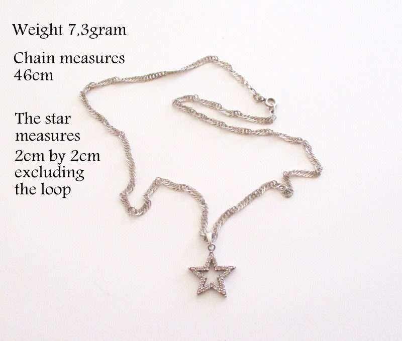 A SOLID SILVER TWISTED ROPE CHAIN AND STAR PENDANT