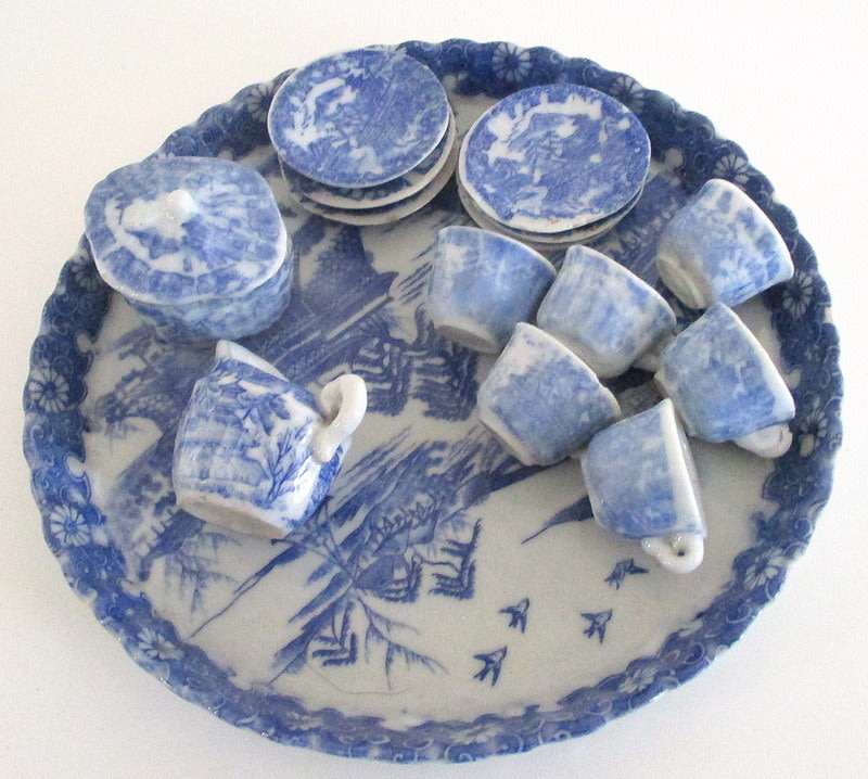 A VICTORIAN SALESMAN'S SAMPLE  PORCELAIN TEA SET ON A TRAY--READ