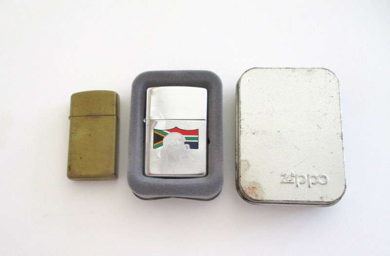 2 ZIPPO LIGHTERS-Check your load shedding times