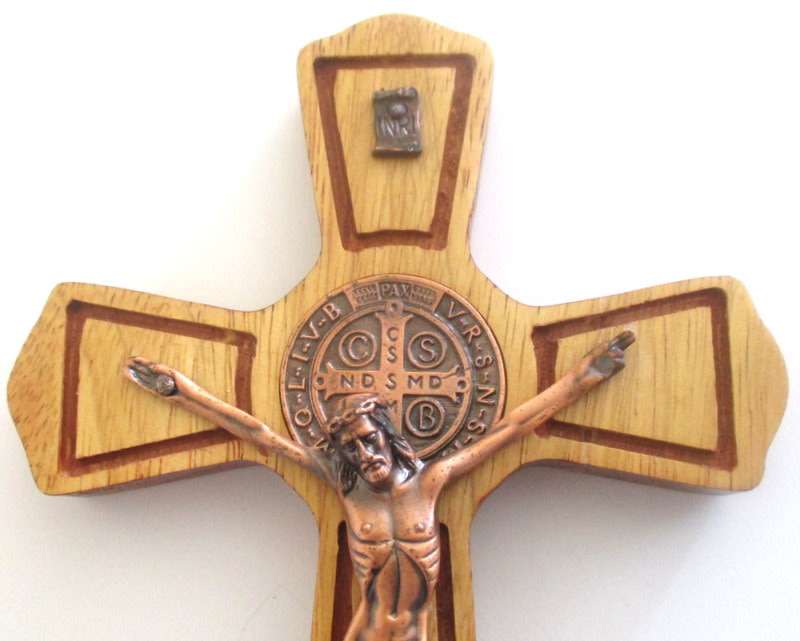 A WOODEN AND COPPER CRUCIFIX