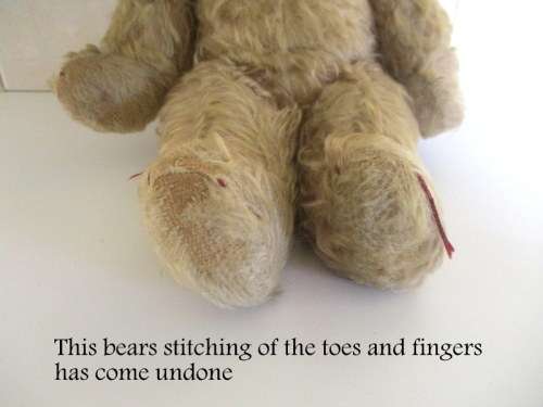 A VINTAGE MOHAIR TEDDY BEAR--NEEDS SOME TLC--PLEASE READ