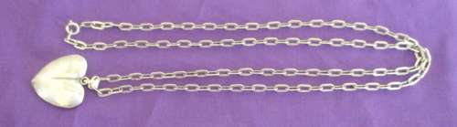 A 72cm LONG STERLING SILVER CHAIN WITH A STERLING SILVER HEART PENDANT