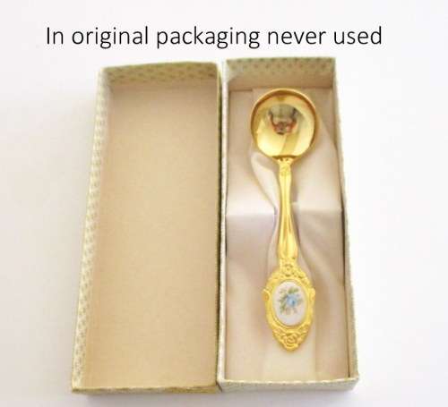 A SET OF BOXED CAKE FORKS AND A SUGAR SPOON--IN ORIGINAL PACKAGING. NEVER USED