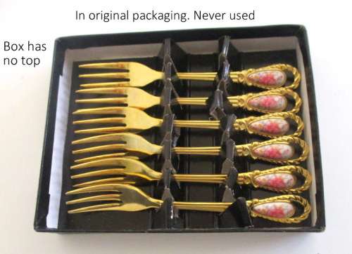A SET OF BOXED CAKE FORKS AND A SUGAR SPOON--IN ORIGINAL PACKAGING. NEVER USED