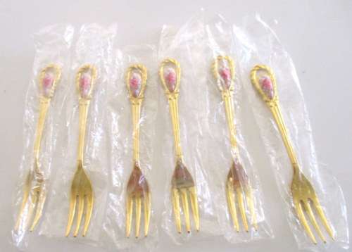 A SET OF BOXED CAKE FORKS AND A SUGAR SPOON--IN ORIGINAL PACKAGING. NEVER USED