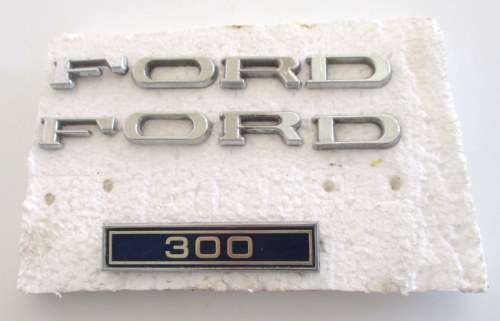 2 FORD CAR BADGES AND A 300 BADGE