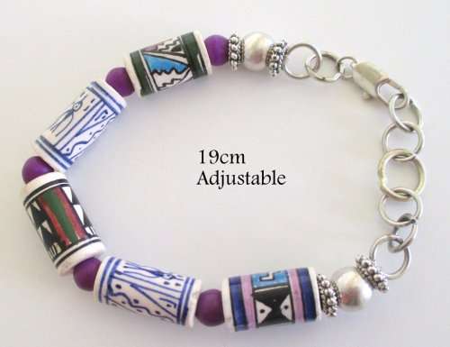 A CERAMIC AND SEMI-PRECIOUS STONE AFRICAN NECKLACE AND BRACELET WITH STAINLESS STEEL CLASP
