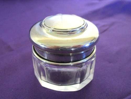 A HALLMARKED SILVER CREAM POT