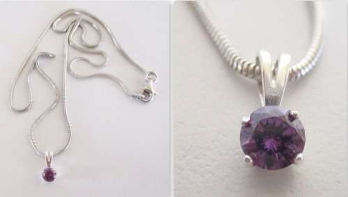 A DAINTY STERLING SILVER PENDANT WITH A DEEP LILAC STONE ON A STERLING SILVER CHAIN