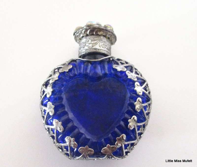 A czechoslovakia cobalt blue glass perfume bottle with silver tone overlay--Perfect