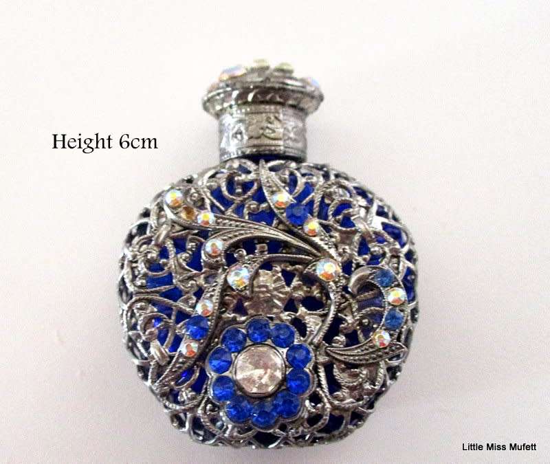A czechoslovakia cobalt blue glass perfume bottle with silver tone overlay--Perfect