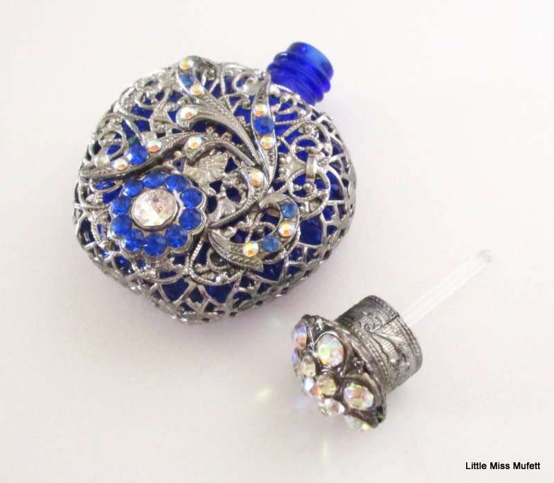 A czechoslovakia cobalt blue glass perfume bottle with silver tone overlay--Perfect