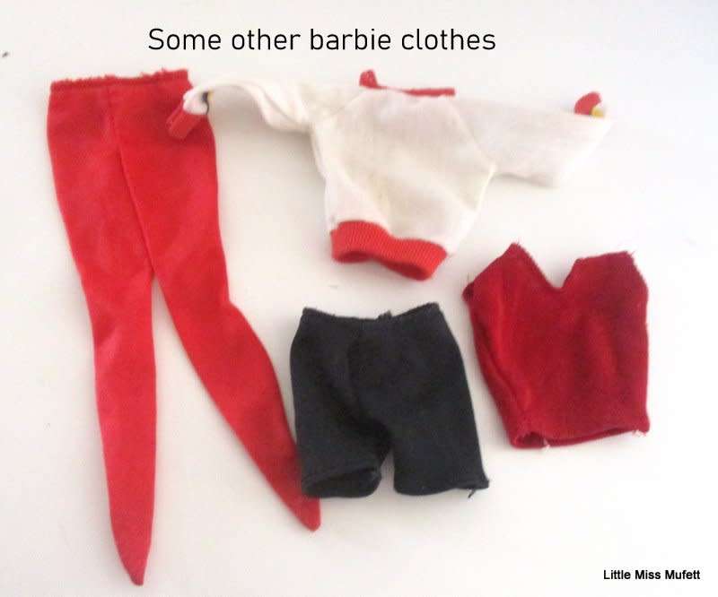 A VINTAGE 1997 BAYWATCH BARBIE DOLL WITH SOME ORIGINAL CLOTHES AND OTHER CLOTHES AND ACCESSORIES