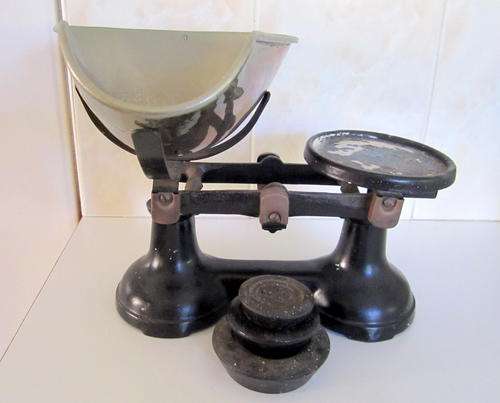 A SCALE WITH 3 WEIGHTS.