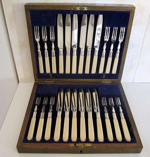 A STUNNING SET OF 24 SILVER PLATED FRUIT KNIVES AND FORKS