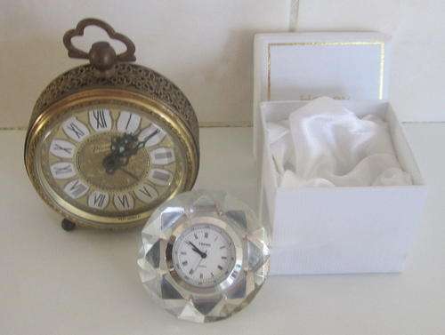 A VINTAGE ALARM CLOCK AND A CRYSTAL CLOCK