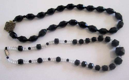 2 STRINGS OF VINTAGE BEADS--BLACK AND CRYSTAL