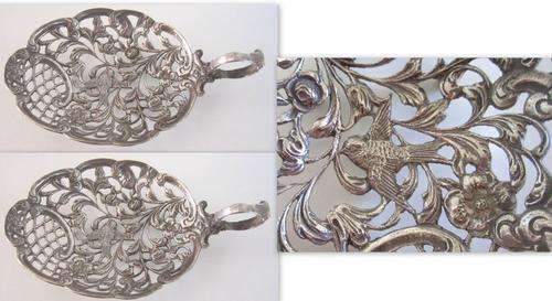 A PAIR OF ATTRACTIVE ITALIAN SILVER PLATED BON BON DISHES --Open work with birds and flowers